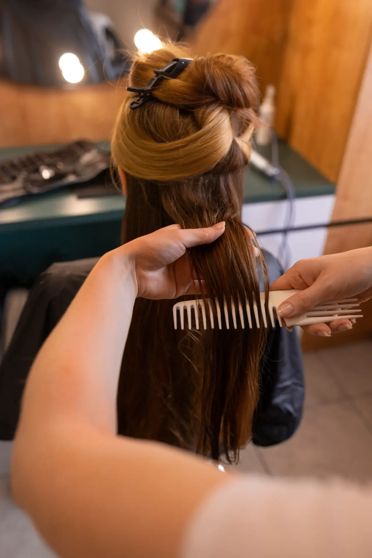 female client getting her hair done hairdresser scaled